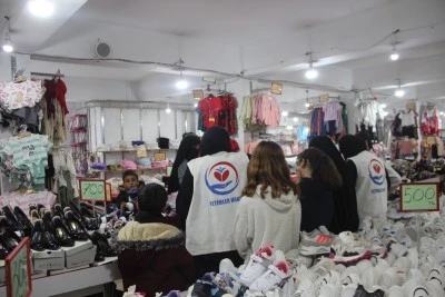 Cizre'de yetim çocuklara bot ve mont desteği